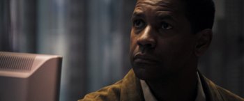 Movie still from “Deja Vu” (2006), directed by Tony Scott – A person looking at something; Close Up shot, Low angle