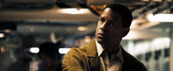 Movie still from “Deja Vu” (2006), directed by Tony Scott – A man that is wearing a jacket; Close Up shot, Low angle