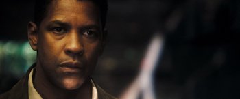 Movie still from “Deja Vu” (2006), directed by Tony Scott – A man's face with a blurry background; Close Up shot, Over the shoulder angle