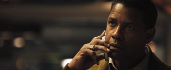 Movie still from “Deja Vu” (2006), directed by Tony Scott – A person talking on a cell phone; Close Up shot, Low angle