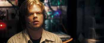 Movie still from “Deja Vu” (2006), directed by Tony Scott – A person wearing a shirt; Close Up shot, Over the shoulder angle