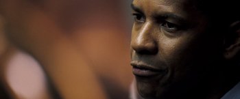 Movie still from “Deja Vu” (2006), directed by Tony Scott – View of a man's face; Close Up shot, Over the shoulder angle