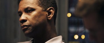 Movie still from “Deja Vu” (2006), directed by Tony Scott – A man's ear and ear plugs; Close Up shot, Low angle