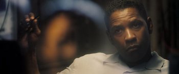 Movie still from “Deja Vu” (2006), directed by Tony Scott – A person wearing a white dress shirt; Close Up shot, Over the shoulder angle