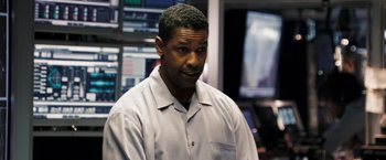 Movie still from “Deja Vu” (2006), directed by Tony Scott – A person wearing a shirt; Medium shot, Over the shoulder angle