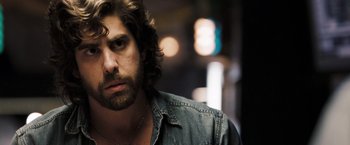 Movie still from “Deja Vu” (2006), directed by Tony Scott – A person wearing a jean jacket; Close Up shot, Low angle