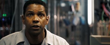 Movie still from “Deja Vu” (2006), directed by Tony Scott – Denzel washington's face as he stares into the distance; Close Up shot, Over the shoulder angle