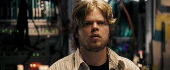 Movie still from “Deja Vu” (2006), directed by Tony Scott – A person with long blonde hair; Close Up shot, Over the shoulder angle