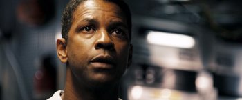 Movie still from “Deja Vu” (2006), directed by Tony Scott – Denzel washington's face as he stares into the distance; Close Up shot, Low angle