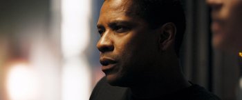 Movie still from “Deja Vu” (2006), directed by Tony Scott – Denzel washington's face in the dark; Close Up shot, Over the shoulder angle