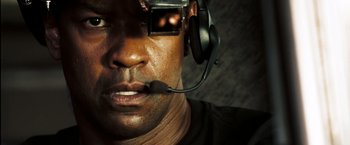 Movie still from “Deja Vu” (2006), directed by Tony Scott – A person wearing a headset; Extreme Close Up shot, High angle