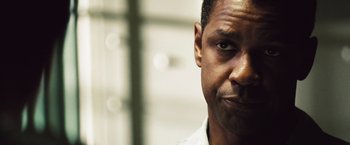 Movie still from “Deja Vu” (2006), directed by Tony Scott – A man's face in a white shirt; Close Up shot, Over the shoulder angle