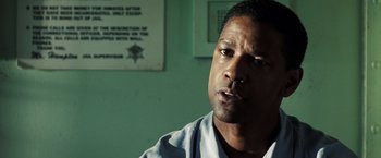 Movie still from “Deja Vu” (2006), directed by Tony Scott – A person in a room near a wall; Close Up shot, Over the shoulder angle