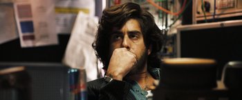 Movie still from “Deja Vu” (2006), directed by Tony Scott – A person with a hand to his face; Close Up shot, Low angle