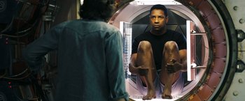 Movie still from “Deja Vu” (2006), directed by Tony Scott – A man sitting in front of a bathroom mirror; Medium shot, Low angle