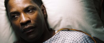 Movie still from “Deja Vu” (2006), directed by Tony Scott – A person laying in a hospital bed; Close Up shot, Overhead angle