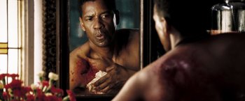 Movie still from “Deja Vu” (2006), directed by Tony Scott – A man looking into a mirror with blood all over his body; Close Up shot, Over the shoulder angle