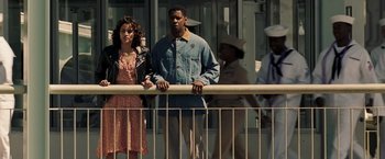 Movie still from “Deja Vu” (2006), directed by Tony Scott – A man and a woman standing next to a railing; Medium shot, High angle