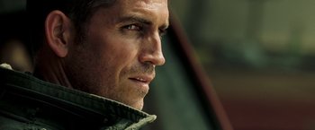 Movie still from “Deja Vu” (2006), directed by Tony Scott – Close up of a man's face looking to his left; Close Up shot, Over the shoulder angle