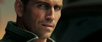 Movie still from “Deja Vu” (2006), directed by Tony Scott – A man's face looking at the camera; Close Up shot, Over the shoulder angle