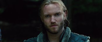 Movie still from “Dracula Untold” (2014), directed by Gary Shore – A person with long hair and a beard; Close Up shot, Over the shoulder angle