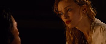 Movie still from “Dracula Untold” (2014), directed by Gary Shore – A person with long red hair; Close Up shot, Over the shoulder angle