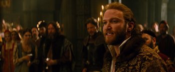 Movie still from “Dracula Untold” (2014), directed by Gary Shore – A group of men standing next to each other in a room; Medium shot, Over the shoulder angle