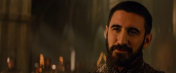 Movie still from “Dracula Untold” (2014), directed by Gary Shore – A man with a beard and a leopard print shirt; Close Up shot, Over the shoulder angle