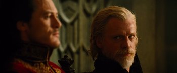 Movie still from “Dracula Untold” (2014), directed by Gary Shore – A man with long blonde hair and a beard; Close Up shot, Over the shoulder angle