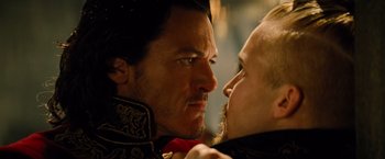 A man and a woman face each other