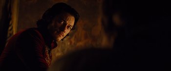 Movie still from “Dracula Untold” (2014), directed by Gary Shore – A man in a dark room looking into a mirror; Close Up shot, Over the shoulder angle