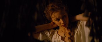 Movie still from “Dracula Untold” (2014), directed by Gary Shore – A woman with a cross in her hair; Close Up shot, High angle