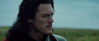 Movie still from “Dracula Untold” (2014), directed by Gary Shore – A person wearing a jacket; Close Up shot, Over the shoulder angle
