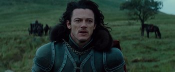 Movie still from “Dracula Untold” (2014), directed by Gary Shore – A person wearing a costume; Close Up shot, Over the shoulder angle
