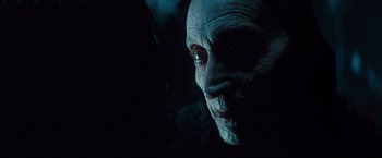 Movie still from “Dracula Untold” (2014), directed by Gary Shore – An old man with a white face and blue eyes; Close Up shot, Over the shoulder angle