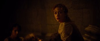 Movie still from “Dracula Untold” (2014), directed by Gary Shore – A young woman is looking into the camera; Close Up shot, Over the shoulder angle