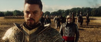 Movie still from “Dracula Untold” (2014), directed by Gary Shore – A group of men in medieval garb walking in a field; Close Up shot, Over the shoulder angle