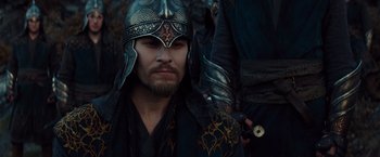 Movie still from “Dracula Untold” (2014), directed by Gary Shore – A person wearing a helmet; Close Up shot, Over the shoulder angle
