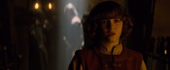 Movie still from “Dracula Untold” (2014), directed by Gary Shore – A young girl is standing in a dark room; Close Up shot, Over the shoulder angle