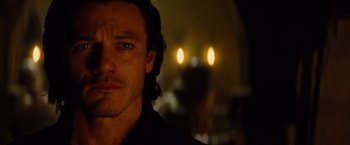 Movie still from “Dracula Untold” (2014), directed by Gary Shore – A man's face in front of candles; Close Up shot, Over the shoulder angle