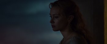 Movie still from “Dracula Untold” (2014), directed by Gary Shore – A young woman is looking into the distance; Close Up shot, Over the shoulder angle