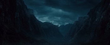 Movie still from “Dracula Untold” (2014), directed by Gary Shore – A dark sky over a mountain range with dark clouds above it; Extreme Wide shot, Low angle