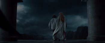 Movie still from “Dracula Untold” (2014), directed by Gary Shore – A couple of people standing next to each other on top of a hill; Wide shot, Low angle
