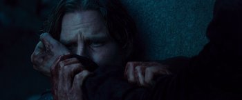 Movie still from “Dracula Untold” (2014), directed by Gary Shore – A person holding a cell phone up to their face; Close Up shot, Over the shoulder angle