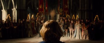 Movie still from “Dracula Untold” (2014), directed by Gary Shore – A crowd of people standing in front of a crowd; Wide shot, Over the shoulder angle