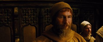 Movie still from “Dracula Untold” (2014), directed by Gary Shore – A man with a long beard wearing a hat; Close Up shot, High angle