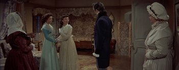 Movie still from “Désirée” (1954), directed by Henry Koster – A man and a woman standing in front of each other in a room; Medium shot, Over the shoulder angle