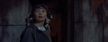 Movie still from “Désirée” (1954), directed by Henry Koster – A woman with a surprised look on her face; Close Up shot, Low angle