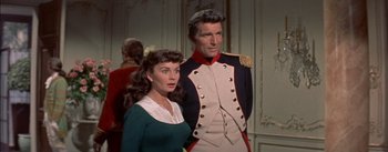 Movie still from “Désirée” (1954), directed by Henry Koster – A man and a woman standing next to each other; Medium shot, High angle