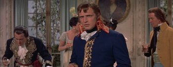 Movie still from “Désirée” (1954), directed by Henry Koster – A man in a blue jacket and a red and gold neck tie; Close Up shot, Over the shoulder angle